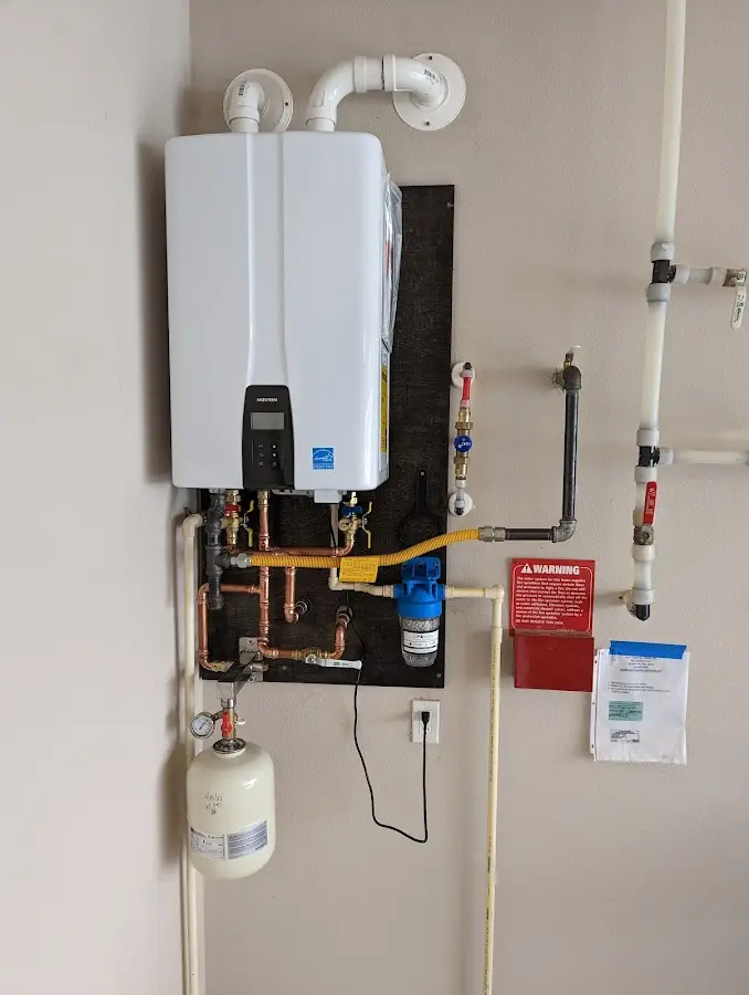 Professional plumber installing copper piping in a Selbyville home