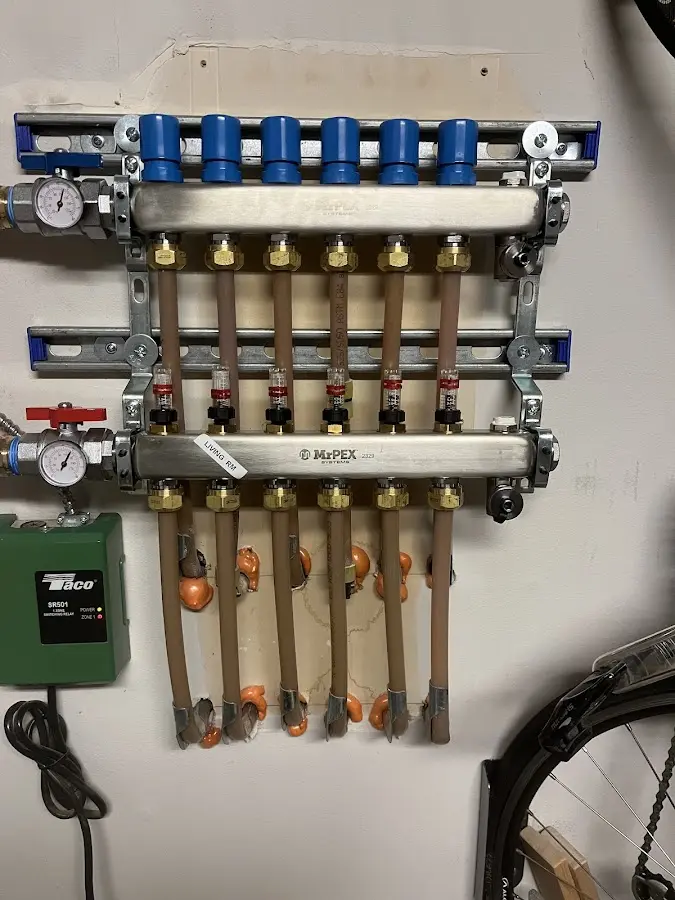 Plumber performing Water Heater Repair at a residential property in Selbyville